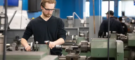 GBC student using millwright machinery
