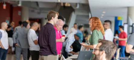 Visitors connect with researchers at the 2025 RIES expo